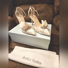 New-In-Box, Never Worn, Comes In Original Packaging Marlene Heels By Bella Belle. Unfortunately I Passed The 30-Day Return Policy So They Now Deserve A Good Home! They're Size 8, Ivory Color, Silk Material, 3.5 Inch Heel, Wide Front And Very Comfy! White Wedding Shoes For Galas, Feminine Wedding Shoes For Formal Occasions, White Wedding Shoes For Gala, Elegant Cream Heels With Heel Strap, Chic Cream Wedding Shoes For Events, Chic Cream Wedding Shoes For Event, Cream Ankle Strap Wedding Shoes, Elegant Off-white Heels With Heel Strap, Elegant Off White Heels With Heel Strap