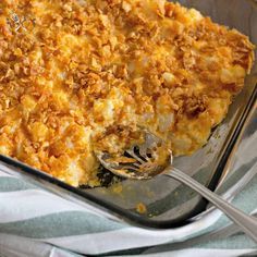 a casserole dish is shown with a fork and spoon in it, ready to be eaten