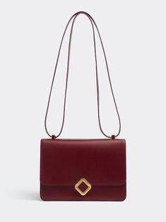 Polomi's Anina Crossbody Bag elevates a minimalist style with its bold finesse. The bag features a crown jewel inlayed cube clasp closure, an expandable gusset and a convertible shoulder strap. [tab] Composition: Box calf exterior; Nappa calf interior Size and Fit: Runs True to Size. 26cm x 18cm x 12cm. Care Instructions: Specialist Clean Origin: Made in France SKU: POL50P67 Questions about size, fit, or how to style? The KZ team is here to help you look and feel your best! Chat with our stylist Clean Origin, Crown Jewels, Minimalist Style, How To Style, Minimalist Fashion, Bordeaux, Convertible, Care Instructions, Crossbody Bag