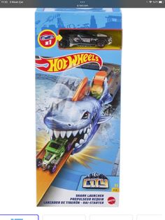 a toy car with a shark on it's back in the packaging for hot wheels