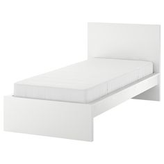 a white bed frame with no sheets on it