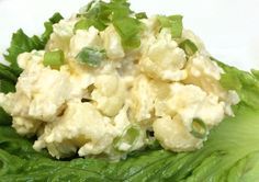 a plate with lettuce and some type of food on it