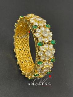 Silver Moissanite Polki Bangles | Polki Bangles | Indian Traditional Bangles | Indian Polki Bangles | Moissanite Bangles | Openable Bangles Material : Silver Gemstone: Moissanite Stone colour: Uncut polki, Hydro Emerald Primary colour: Gold Bangle : Openable Bangle Silver Intricate, hand crafted, Pure Silver Moissanite Polki Bangles, studded with high quality uncut moissanite polki Bangles , made in 92.5 silver with 22ct gold plating. Product comes with 92.5 silver hallmark. Bangles are Openable Elegant Gemstone Cuff Bracelet For Wedding, Fusion Style Wedding Bracelets With Cutdana, Fusion Style Cutdana Bracelets For Wedding, Luxury Gemstone Cuff Bracelet For Weddings, Silver Cutdana Bracelet For Formal Occasions, Formal Silver Bracelet With Cutdana, Cutdana Bangle Jewelry For Reception, Green Diamond Wedding Bracelets, Cutdana Bangle For Receptions