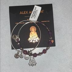 No Box. Set Of Two. Includes Two Bracelets Charm Bangle: Expandable Design;Smaller Charms With Alex And Ani Logo And Other Markings.Beaded Bangle: Expandable Design, Various Sizes Of Faceted Swarovski Crystals With Polished Diamond-Design Stations, And Smaller Charms With Alex And Ani Logo And Other Marking.Buddha: Silvertone, Purple Crystals. Fits Small To Average Wrists Each Bangle Measures Approximately 1/4"W; Charms Vary In Size. Silver Stackable Amethyst Jewelry, Silver Amethyst Stackable Jewelry, Silver Amethyst Hypoallergenic Jewelry, Hypoallergenic Silver Amethyst Jewelry, Hypoallergenic Amethyst Silver Jewelry, Alex And Ani Bangles, Bracelets Charm, Small Charms, Charm Bangle