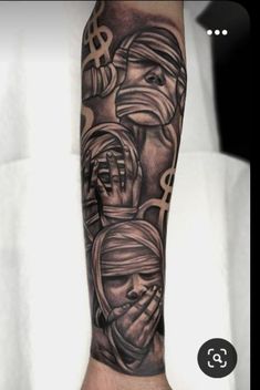 a man's arm with some tattoos on it