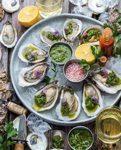 oysters on the half shell with herbs and sauces