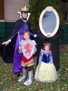 two children and an adult are dressed up as princesses in costumes for the day