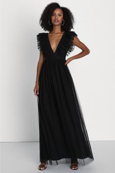 We can't wait for the perfect occasion to come around so we can stun everyone with the Lulus Simply Delighted Black Mesh Ruffled Backless Maxi Dress! This stunning dress is composed of sheer mesh fabric (atop a matching knit liner) that shapes wide straps adorned with flouncy ruffled trim, wide straps, and a sleeveless bodice with a sultry backless design. A high, banded waist tops a twirl-worthy, A-line skirt that cascades down to a sweeping maxi hem. Hidden back zipper/clasp. Fit: This garment Sheer V-neck Maxi Dress For Evening, Sheer Backless Mesh Evening Dress, Sleeveless Flirty Evening Dress, Sheer Dresses For Evening Night Out, Evening Party Maxi Dress With Ruffles, Chic Backless Mesh Dress, Chic V-neck Mesh Dress For Evening, Flirty Evening Dress For Prom Season, Backless Flirty Maxi Dress For Prom