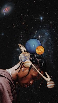 a man with dreadlocks and planets on his head in the middle of space