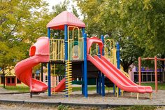 a colorful playground with slides and climbing equipment