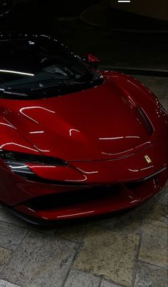 a red sports car parked in a garage