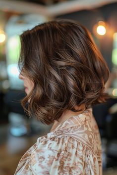 Woman with brown hair featuring subtle highlights. Subtle Highlights, Hair Color