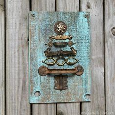 an old door handle is attached to a wooden panel with metal handles and knobs