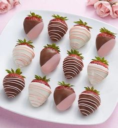 chocolate covered strawberries are arranged on a plate