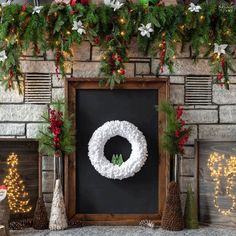 christmas decorations and wreaths are displayed in front of a fireplace