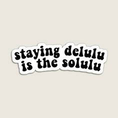 a sticker that says staying delu is the soluly in black ink