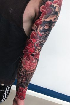 a man with a tattoo on his arm