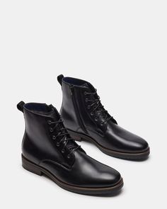 1.25 inch heel height 10.25 inch shaft circumference 5.75 inch shaft height Leather upper material Leather lining Leather sock Rubber sole Imported Leather Socks, Men's Boots, Rubber Sole, Heel Height, Leather Upper, Ankle Boot, Black Leather, Lace Up, Boots