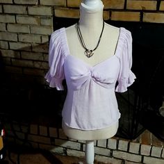 Color:Lavender Size: Medium 72% Rayon &28% Polyester Lining 100%Polyester. Elastic Puffed Sleeves. Can Be On Or Off Shoulders. Has A Zipper On Side. Elastic Back. It's A Short Top 14inches Long New With Tags. Comes From A Smoke Free Home By: Nine West Fitted Lavender V-neck Blouse, Chic Lavender Fitted Top, Chic Fitted Lavender Blouse, Fitted Lavender Short Sleeve Blouse, Fitted Lavender Blouse For Spring, Feminine Fitted Lavender Top, Fitted Lavender Casual Blouse, Fitted Feminine Lavender Blouse, Camo Bra