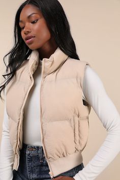 Keep your winter looks toasty and on-trend with the Lulus Warm Aesthetic Beige Mock Neck Puffer Vest! Quilted nylon shapes this essential vest that has a mock neckline and a sleeveless bodice with a front zipper. Twin welt pockets offer a cozy spot for your hands, and a cropped, ribbed knit hem completes the look. Fit: This garment fits true to size. Length: Size medium measures 20.5" from shoulder to hem. Bust: Great for any cup size. Waist: Loosely Fitted. Fabric: Fabric has no stretch. Lined. Light Brown Vest Outfit, Beige Vest Outfit, White Puffer Vest Outfit, Tan Puffer Vest, Brown Vest Outfit, Essential Vest, Cropped Puffer Vest, Beige Puffer, Vest Quilted