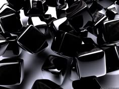 many black and white cubes are scattered together