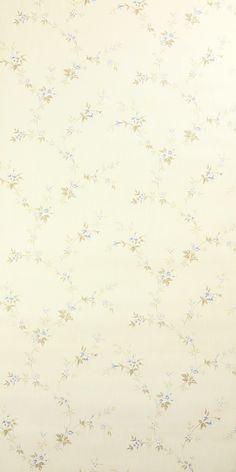 a white wall with blue flowers on it