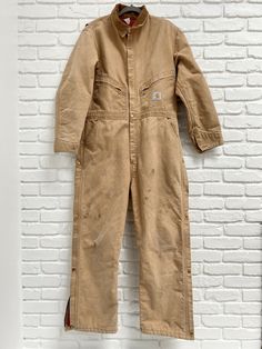 Vintage 1989 100 Years Carhartt Jumpsuit Large red lined excellent 80’s Snap and zipper Leg. Size 44R Coveralls. Zipper pockets. This has been freshly washed and dried. Any blemishes you see have remained after washing, but these things are supposed to get worn anyway. A very cool piece of Carhartt history! PROUDLY USA MADE!!! Vintage Carhartt Women, Carhartt Jumpsuit, Carhartt Vintage, Painters Overalls, Grease Costume, Carhartt Women, Men Carhartt, Vintage Wrangler, Boiler Suit