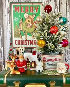 an old suitcase with christmas decorations on it