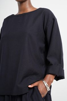 Any easy-fitting long sleeve top with a wide neckline, crafted in wool to keep cozy during colder months. 100% Wool Effortless Long Sleeve Black Tops, Relaxed Fit Boat Neck Tops For Fall, Chic Oversized Boat Neck Top, Effortless Long Sleeve Tops For Fall, 3/4 Sleeve Tops For Winter Workwear, Winter Workwear Top With 3/4 Sleeves, Oversized Fine Knit Tops For Work, Winter Workwear Tops With 3/4 Sleeve, Oversized Fine Knit Work Tops