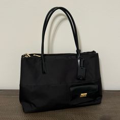 Tumi Larkin Hayes Triple Compartment Tote Bag Black With Gold Hardware Mix Of Leather And Material Very Nice, Barely Used And In Amazing Condition ~Open To Offers!~ Can Hold Many Items Including Everyday Items, And Has A Compartment For A Laptop Or Notebook, As Well As Compartments For Smaller Items Like Pens, Keys, Money, Or Makeup Total Of 5 Large Compartments Perfect For Travel, Leisure, Or Work Comes With Brand New Travel Nametag Dimensions! 16”L X 7”W X 11.5”H Chic Tan Shoulder Bag With Zipper Closure, Elegant Tan Shoulder Bag For Travel, Elegant Tan Shoulder Bag With Zipper, Elegant Black Shoulder Bag With Zipper Closure, Formal Tan Bag With Zipper Closure, Chic Tan Bags For Work, Chic Tan Workwear Bags, Tumi Bags, Tote Bag Black