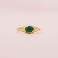 Make a statement with this eye-catching signet ring! Crafted in gold and featuring an emerald green beryl center stone, this ring is sure to turn heads. Show off your unique style while adding a touch of sparkle to any ensemble. Sparkle on!  DETAILS - sizes 3-9 available - 14kt gold plated over sterling silver - emerald green beryl center stone Also available with White Topaz and White Topaz center stones. Giving this as a gift or just want to treat yourself? Add our beautiful velvet ring gift box to your order for a gift that really wows! Velvet gift box: https://etsy.me/3h8Wocx Packaging + Delivery: All items come packaged in a cute Amanda Deer Jewelry box and are sent in a protective bubble mailer. If ordering multiple pieces, please let us know if you'd like separate boxes for each one Fine Jewelry Green Signet Ring With Birthstone, Formal Green Emerald Signet Ring, Classic Green Open Signet Ring, Green Emerald Signet Ring Fine Jewelry, Green Oval Signet Ring For Anniversary, Gold Emerald Signet Ring Gift, Oval Green Signet Ring For Anniversary, Oval Green Emerald Signet Ring, Oval Signet Ring With May Birthstone Gemstone