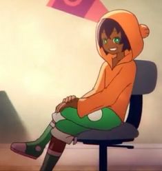 a person sitting on top of a chair in an orange hoodie and green leggings