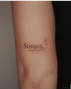 someone with a tattoo on their arm saying somos