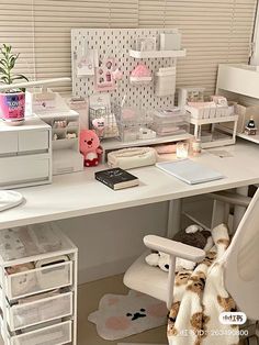 a white desk topped with lots of drawers