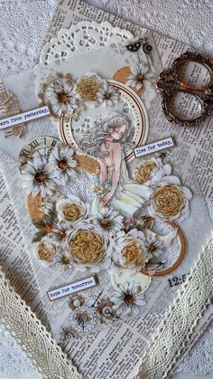 an altered photograph with flowers and scissors on a lace doily next to some other items