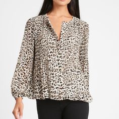 Soft, Sheer Georgette Lined Body. Unlined Sleeves. Delicate Pleats- Crisp Pleats At The Shoulders Create An Effortless Drape For This Flowing Top. Button Front. Crew Neck. Semi-Fitted. Long Sleeves. Cheetah Print Original Price $89.50 Leopard Print Tops For Spring, Leopard Print Blouse For Fall, Trendy Leopard Print V-neck Top, Chic Fall Tiger Print Tops, Fall Tiger Print Tops, Trendy Leopard Print V-neck Blouse, Chic Leopard Print Tops For Work, Casual Leopard Print Blouse, Casual Leopard Print Blouse For Fall