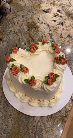 a heart shaped cake sitting on top of a counter