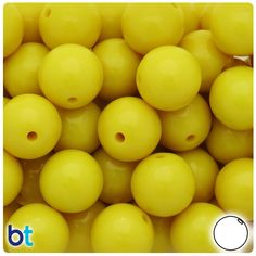 yellow plastic beads with holes in the middle