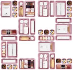 an assortment of makeup and beauty products arranged in pink trays on a white background