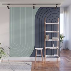 a living room with a book shelf, chair and plant