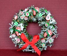 a christmas wreath with candy on it