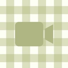 a green and white checkered table cloth with an empty speech bubble