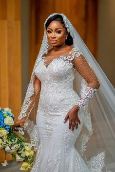 a woman in a wedding dress holding a bouquet