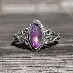 Handmade genuine marquise amethyst ring made with 925 stamped sterling silver. Amethyst is said to enhance spiritual awareness and promotes inner peace. It is also believed to protect you against negativity. Care instructions: Sterling silver is tarnish free unless it is exposed to certain chemicals so take care of your rings. Not all crystals are water safe so not swimming or wetting them is recommended.  Please note that each stone may differ slightly, no two have the exact same appearance & e Silver Marquise Birthstone Ring As A Gift, Silver Marquise Birthstone Ring For Gift, Silver Marquise Moonstone Ring, Spiritual Oval Amethyst Ring With Stone Setting, Spiritual Amethyst Birthstone Ring In Sterling Silver, Spiritual Sterling Silver Amethyst Birthstone Ring, Spiritual Silver Amethyst Ring, Marquise Amethyst Ring In Purple, Spiritual Sterling Silver Hallmarked Amethyst Ring