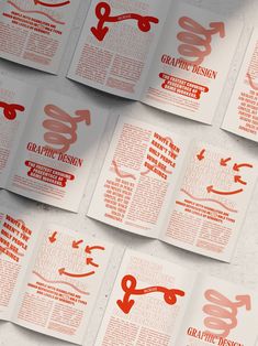 an array of brochures with red and white designs on them, including scissors