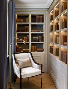 the instagram page shows an image of a room with bookshelves and a chair