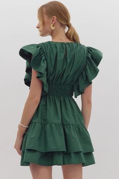 Solid tiered ruffled v-neck mini dress featuring ruffled sleeves. Elasticized waist. Button closure at back. Lined. 65% polyester 35% cotton Green Dress Casual, Ruffled Sleeves, Bag Dress, Tee Dress, Cutie Patootie, Green Dress, Womens Tees, Casual Dresses, Fashion Inspo