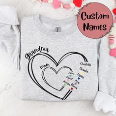 The perfect custom sweatshirt for Grandma! Please put names separated by Grandma/Mom in the personalization spot. You will be sent a mockup in messages (usually within 1-2 business days) of what your shirt will look like before it is made. If you have any questions, please send BEFORE purchasing! Shirt will not be made until it is approved. If your mockup is not approved, your order will be cancelled.  50/50 Cotton & Polyester Blend. Gildan Brand Fit: All shirts are unisex fit, true to size, loose fit. Recommend going up 1-2 sizes for an oversized look. Please check the size chart. If you have any questions, please contact us. Please check your address to make sure it is your current address. Care Instructions:  For the best and lasting results, wash in cold water inside out. No bleach. Dr Diy Gifts For Grandma, Grandma Sweatshirt, Grandma Shirt, Grandma Shirts, Custom Sweatshirts, Mom Sweatshirt, Grandma Gifts, Grandchildren, 50 50