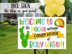 a welcome sign with balloons in front of a house