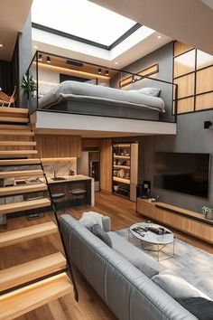 a living room filled with furniture and a flat screen tv mounted to the side of a wall